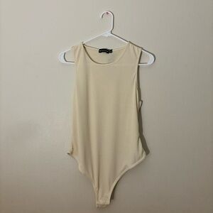 PrettyLittleThing Cream Basic Stone Rib Racer Bodysuit